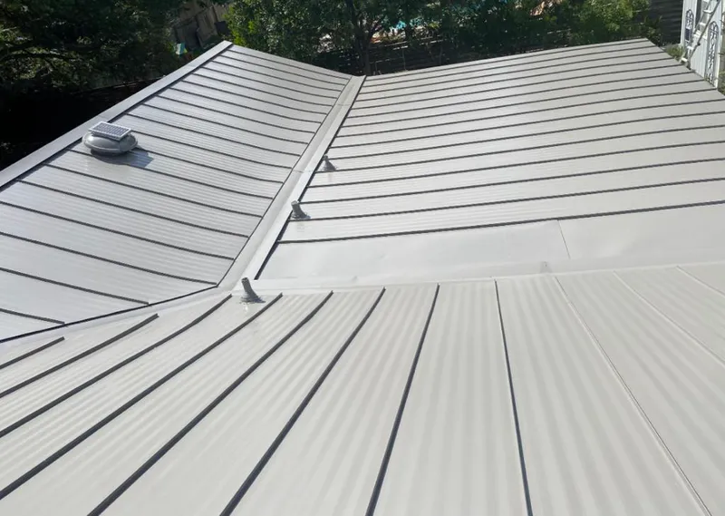 Solar attic fan installed on a metal roof for Roof Ventilation in Atmore